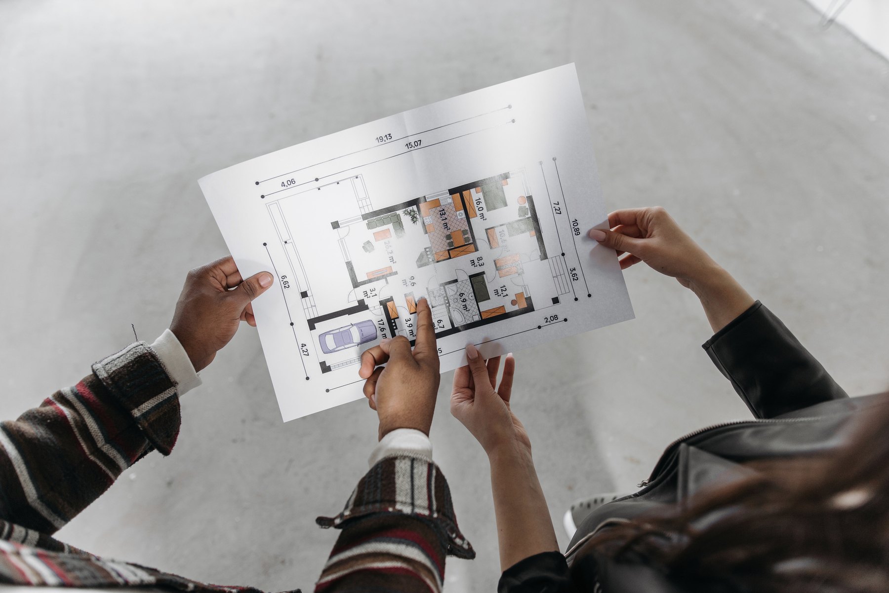 Designer reviewing drawings at a desk